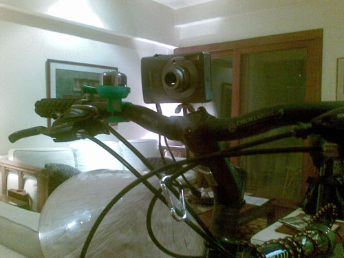 A home-made camera mount. Note the little silver clip to prevent my wheels from obliterating the camera if it falls off.