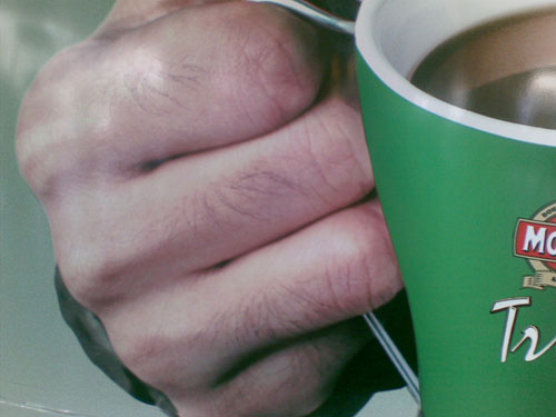 The guy's knuckles as they appear in the original ad, in all their cro-magnon glory (like I'm one to speak).