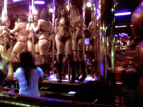 Taken in secret with my phone in your average Bangkok girlie bar. This unimaginative scene is what many bars are happy to have, but at this bar, it was broken up by an interesting - yet still erotic, natch - dance show. Granted, it's not a huge departure from the norm, but at least they're trying something new!