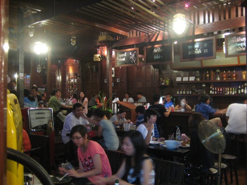 Most restaurants and shops at Amphawa Floating Market have this undefined retro coolness about them - dark wood, bright lights, funky decorations.