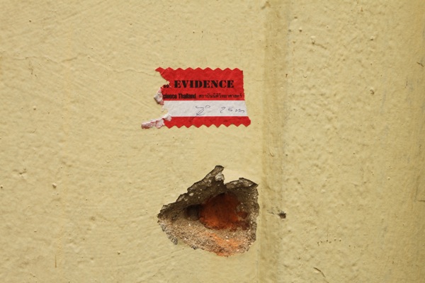 A bullet hole in the wall of Wat Pahtum Wanaram.