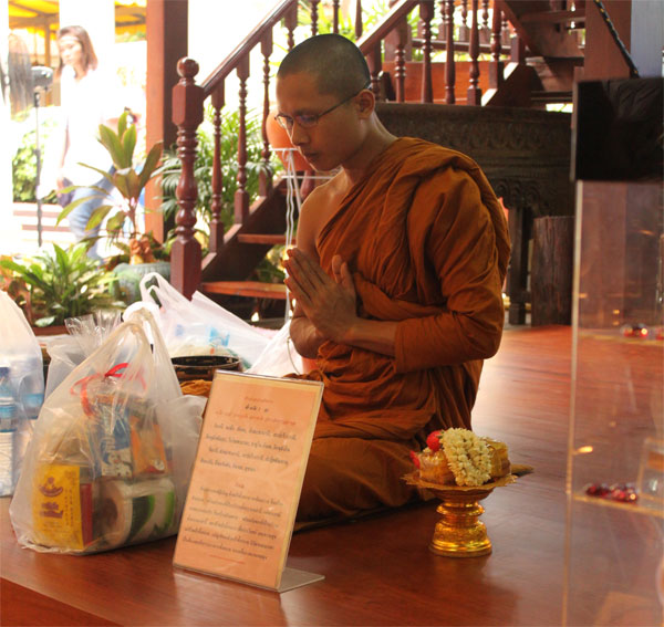 The monk we made our offering to. He seemed pretty calm... I think I could do it if I had uncensored high speed internet access.