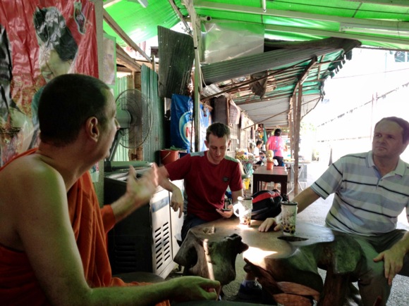 Phra Pandit explaining the history of his temple to Matt and Richard.